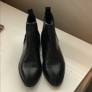 Black booties with stud detailing